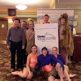 Thanking a generous sponsor of the evening, Cooke Aquaculture Inc.: Keng-Pee Ang, Thierry Chopin, Cynthia Croker, Jack Langenhuizen, Laura Day; sitting: Melissa Spence, James Croker and Sarah Felschow.